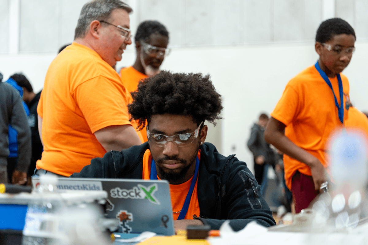 Marcelus Coding At Robotics Competition